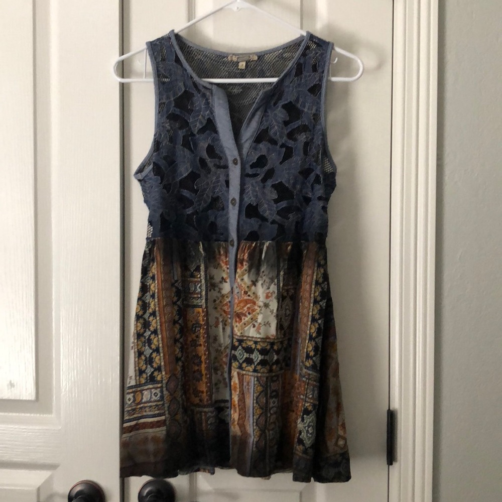 Gimmicks sleeveless shirt.